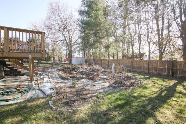 20 Sims Rd, Bristol, CT 06010 - view of yard with stairway, a storage shed, a deck, a fenced backyard, and an outbuilding