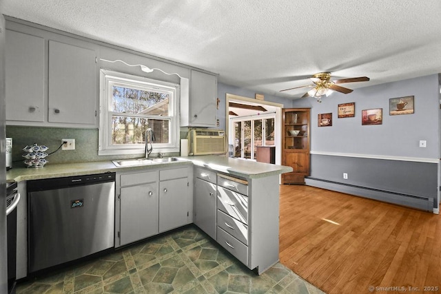 20 Sims Rd, Bristol, CT 06010 - kitchen featuring a baseboard heating unit, stainless steel dishwasher, a sink, and a textured ceiling