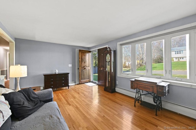 20 Sims Rd, Bristol, CT 06010 - living area with light wood-style flooring, baseboards, and a baseboard radiator