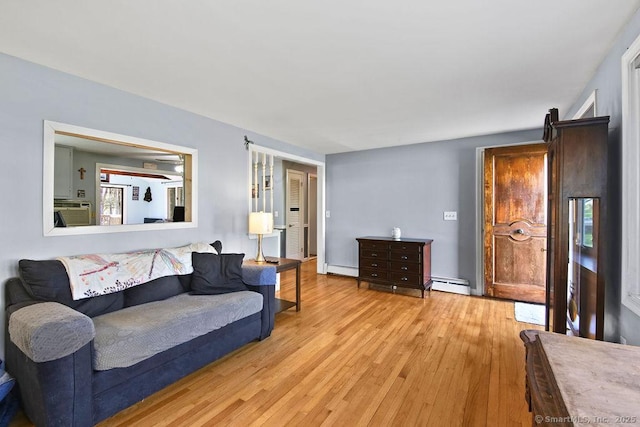 20 Sims Rd, Bristol, CT 06010 - living area featuring a baseboard heating unit, wood finished floors, and baseboard heating
