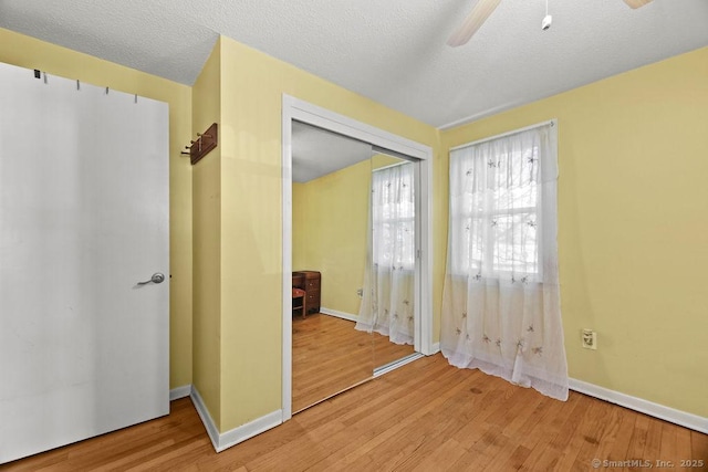 20 Sims Rd, Bristol, CT 06010 - unfurnished bedroom featuring baseboards, a ceiling fan, wood finished floors, and a closet