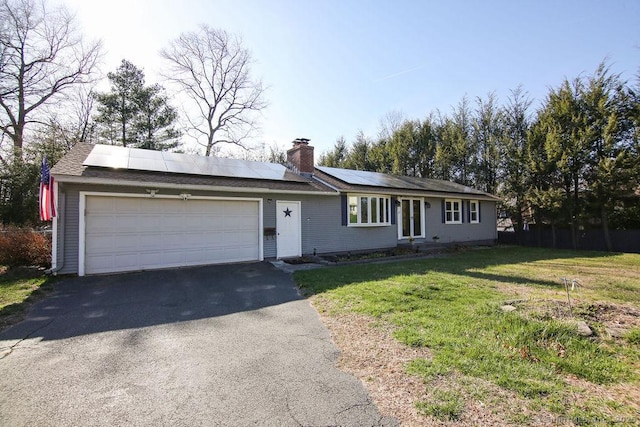 20 Sims Rd, Bristol, CT 06010 - single story home featuring a front lawn, solar panels, driveway, a chimney, and a garage