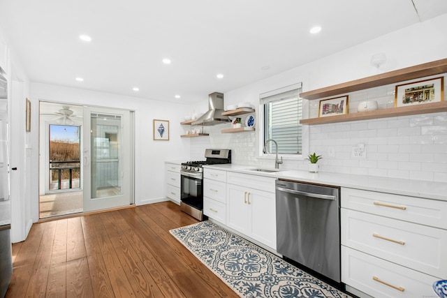 1240 Fairfield Beach Rd, Fairfield, CT 06824 - kitchen with a sink, wall chimney range hood, open shelves, light countertops, and appliances with stainless steel finishes