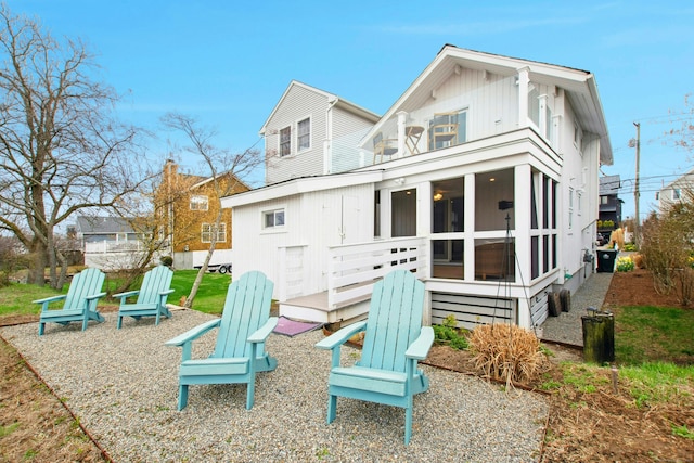 1240 Fairfield Beach Rd, Fairfield, CT 06824 - back of property featuring a sunroom