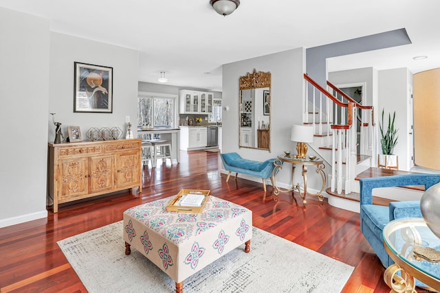 190 Thoreau Dr, Shelton, CT 06484 - living room with stairway, baseboards, and wood finished floors