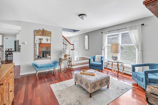 190 Thoreau Dr, Shelton, CT 06484 - living area featuring a baseboard radiator, wood finished floors, baseboards, and stairway