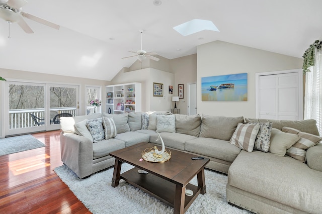 190 Thoreau Dr, Shelton, CT 06484 - living room with lofted ceiling with skylight, wood finished floors, and ceiling fan