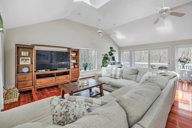 190 Thoreau Dr, Shelton, CT 06484 - living room with dark wood-type flooring, lofted ceiling with skylight, ceiling fan, and plenty of natural light