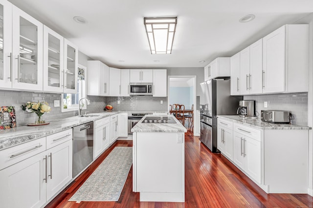 190 Thoreau Dr, Shelton, CT 06484 - kitchen featuring light stone countertops, a sink, appliances with stainless steel finishes, and tasteful backsplash