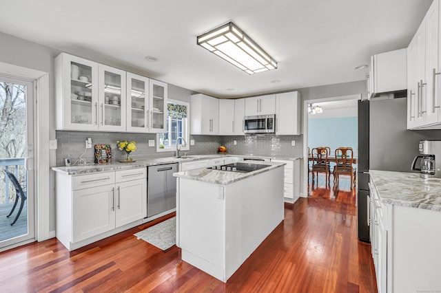 190 Thoreau Dr, Shelton, CT 06484 - kitchen with backsplash, appliances with stainless steel finishes, dark wood-type flooring, and glass insert cabinets