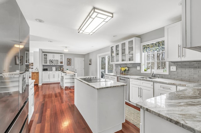 190 Thoreau Dr, Shelton, CT 06484 - kitchen with tasteful backsplash, a sink, a wealth of natural light, appliances with stainless steel finishes, and a kitchen island