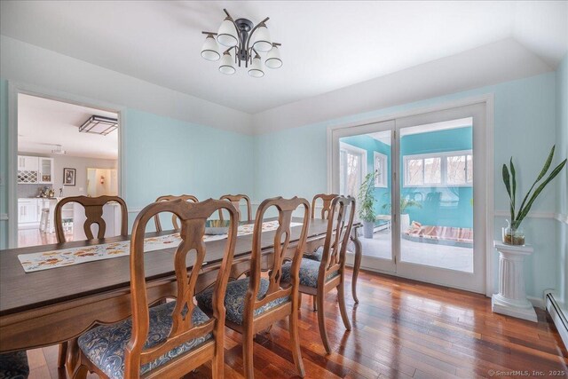 190 Thoreau Dr, Shelton, CT 06484 - dining room with hardwood / wood-style floors, a baseboard heating unit, and a chandelier