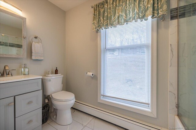 190 Thoreau Dr, Shelton, CT 06484 - bathroom featuring a baseboard heating unit, vanity, toilet, a shower, and marble look tile flooring