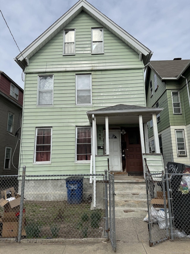 148 Plymouth St, New Haven, CT 06519 - view of front of house featuring a porch, a gate, and a fenced front yard