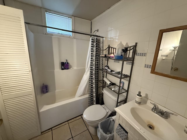 148 Plymouth St, New Haven, CT 06519 - bathroom with tile patterned floors, a sink, tile walls, shower / bath combination with curtain, and toilet