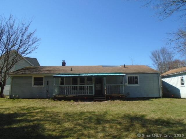 35 Greenhouse Blvd, West Hartford, CT 06110 - rear view of house featuring a porch and a yard