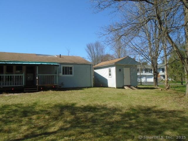 35 Greenhouse Blvd, West Hartford, CT 06110 - view of yard with a shed, an outbuilding, and a porch