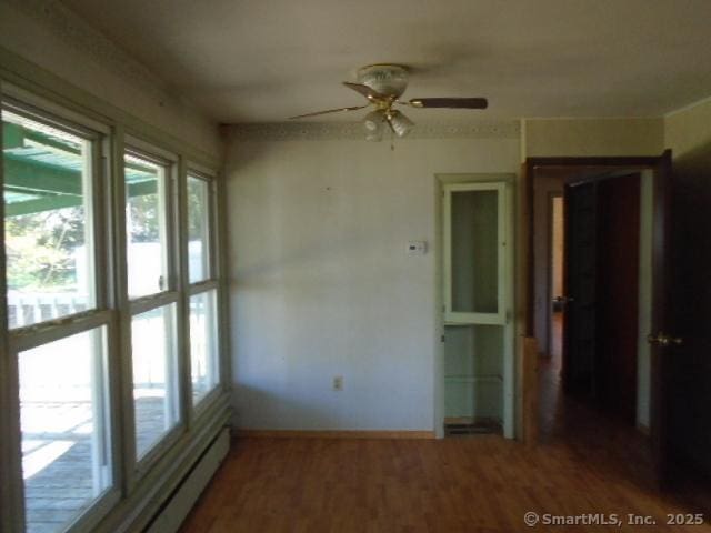 35 Greenhouse Blvd, West Hartford, CT 06110 - spare room with baseboards, a ceiling fan, and wood finished floors