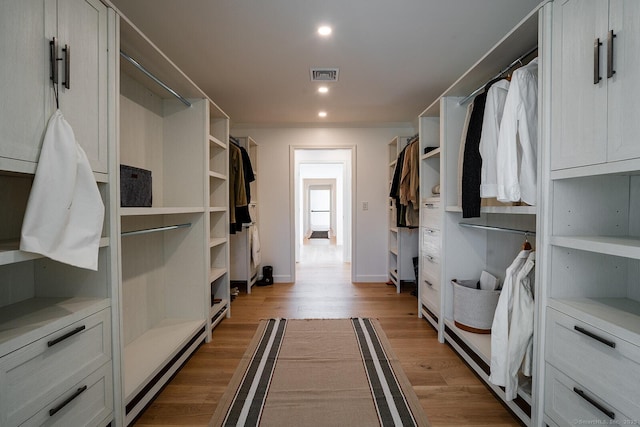 spacious closet featuring visible vents and light wood finished floors
