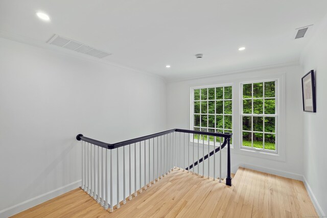 148 W Hills Rd, New Canaan, CT 06840 - stairway with wood finished floors, baseboards, crown molding, and recessed lighting
