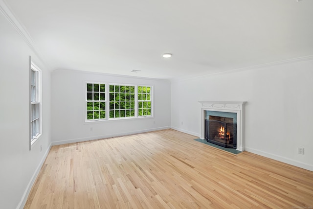 148 W Hills Rd, New Canaan, CT 06840 - unfurnished living room with ornamental molding, light wood finished floors, baseboards, and a fireplace with flush hearth