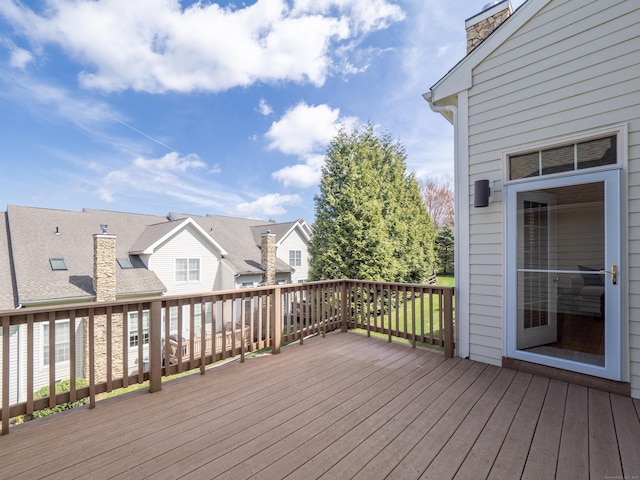 wooden deck with a residential view