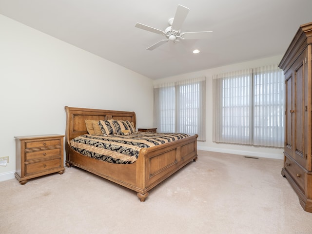 bedroom with baseboards, visible vents, light colored carpet, and recessed lighting