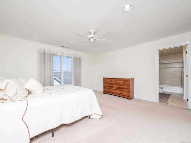 bedroom featuring recessed lighting, a ceiling fan, light carpet, and ensuite bathroom