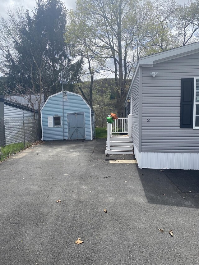 exterior space featuring a shed