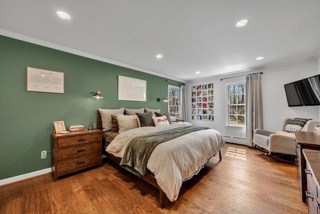 bedroom featuring wood finished floors, baseboards, recessed lighting, and crown molding