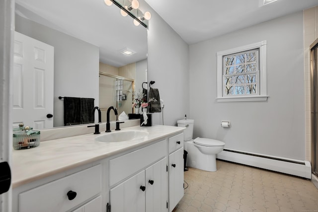 bathroom featuring baseboard heating, tile patterned floors, a stall shower, vanity, and toilet