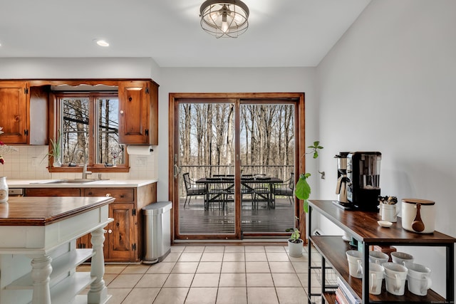 dining room featuring light tile patterned flooring, recessed lighting, and a healthy amount of sunlight