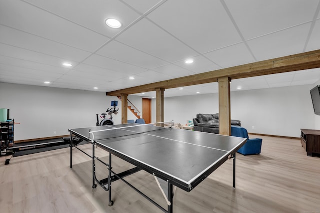 game room featuring recessed lighting, light wood-style floors, a paneled ceiling, and baseboards