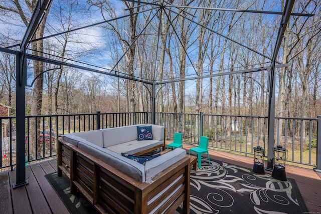 wooden deck featuring outdoor lounge area