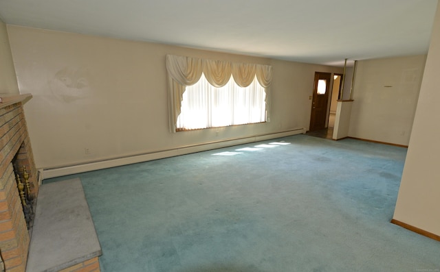 unfurnished living room with carpet, baseboards, a baseboard heating unit, and a brick fireplace