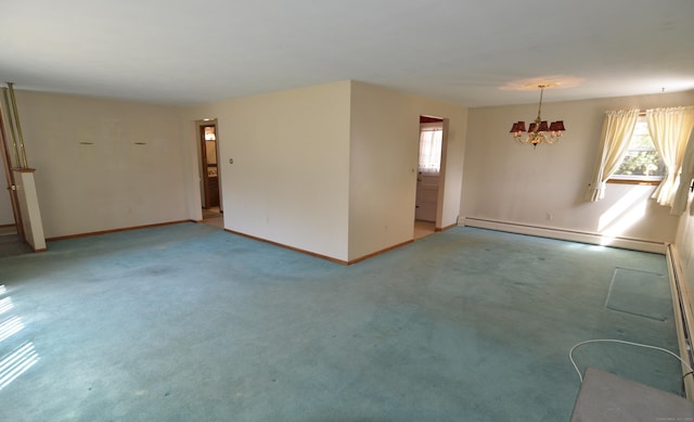 empty room featuring a wealth of natural light, baseboards, a notable chandelier, and a baseboard heating unit