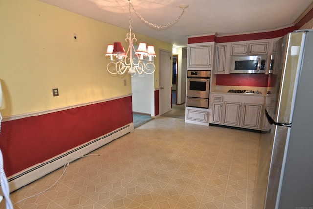 kitchen featuring an inviting chandelier, a baseboard radiator, appliances with stainless steel finishes, light countertops, and a warming drawer