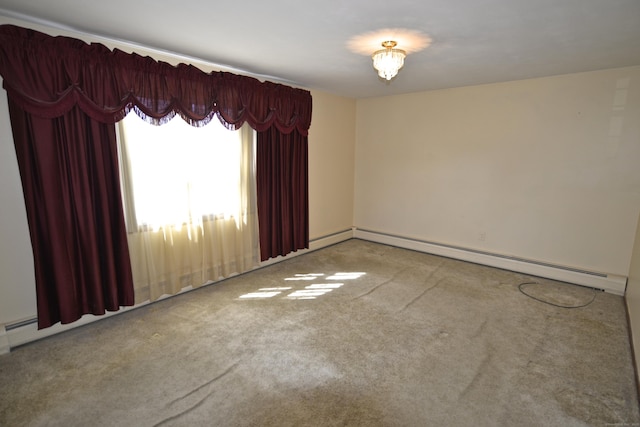 unfurnished room with carpet flooring and a baseboard heating unit
