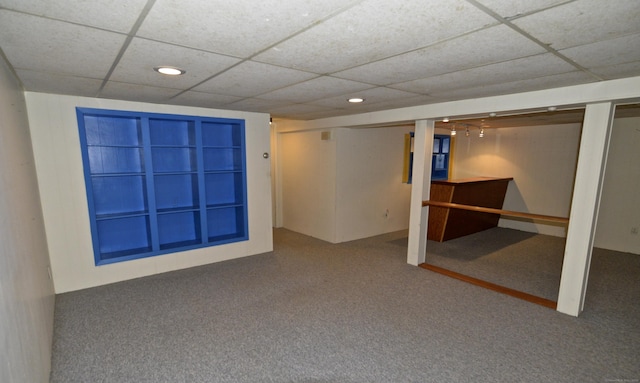 spare room featuring carpet, a drop ceiling, and recessed lighting