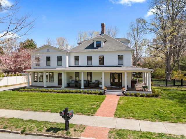 101 N Main St, Essex, CT 06426 - view of front facade featuring fence, a porch, and a front yard