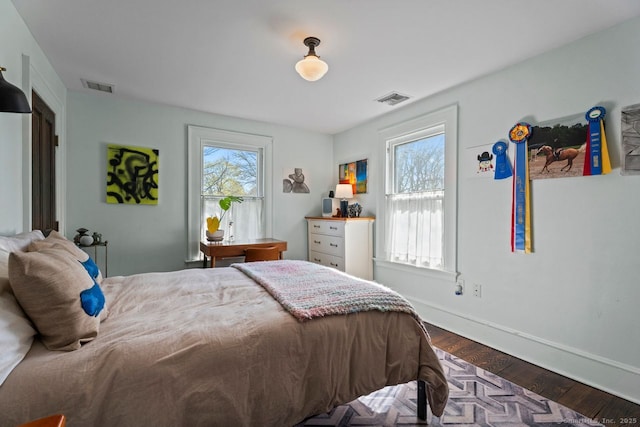 101 N Main St, Essex, CT 06426 - bedroom featuring dark wood-style flooring, visible vents, and multiple windows