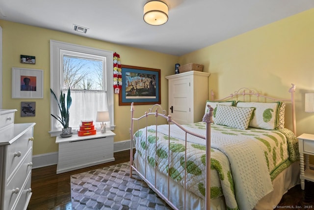 101 N Main St, Essex, CT 06426 - bedroom with dark wood finished floors, visible vents, and baseboards