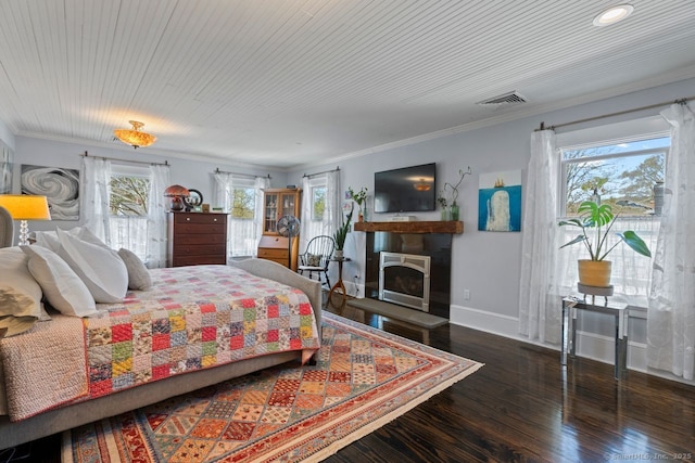 101 N Main St, Essex, CT 06426 - bedroom featuring wood finished floors, ornamental molding, a fireplace with raised hearth, baseboards, and visible vents