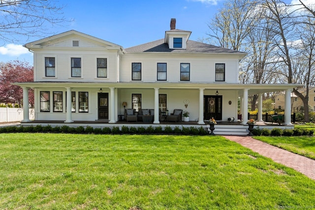 101 N Main St, Essex, CT 06426 - view of front facade with a front lawn, fence, covered porch, and a chimney