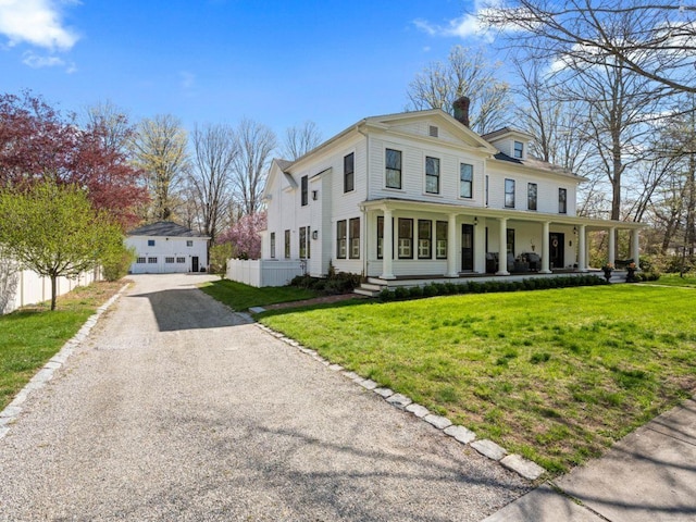 101 N Main St, Essex, CT 06426 - greek revival inspired property with a porch, a front lawn, an outbuilding, a chimney, and fence