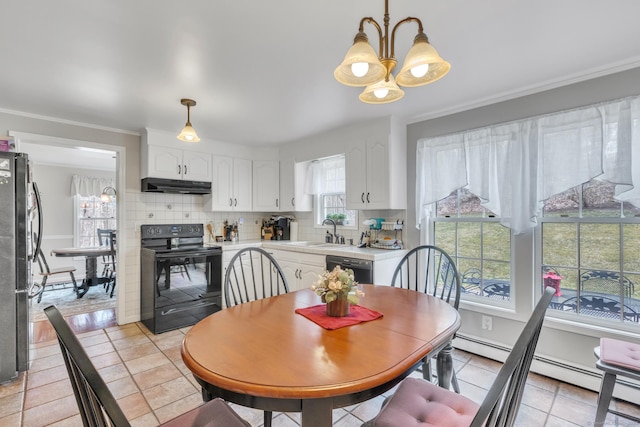 dining room with crown molding, a baseboard heating unit, light tile patterned flooring, and a notable chandelier