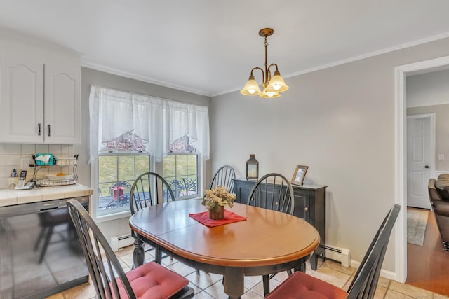 dining area with baseboards, a baseboard radiator, a chandelier, and ornamental molding