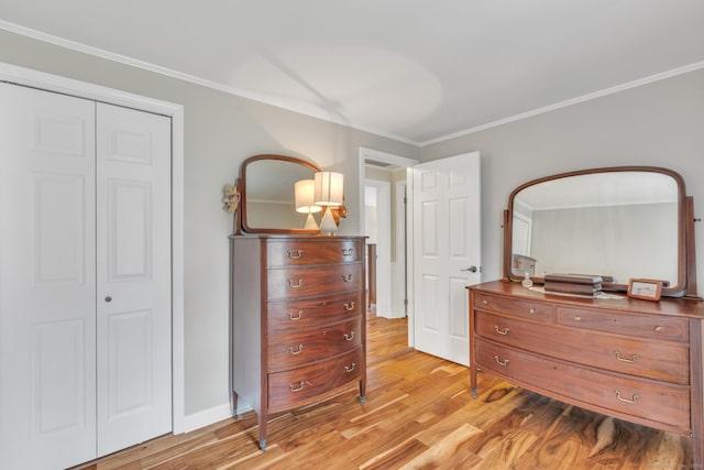 bedroom featuring light wood-type flooring and ornamental molding