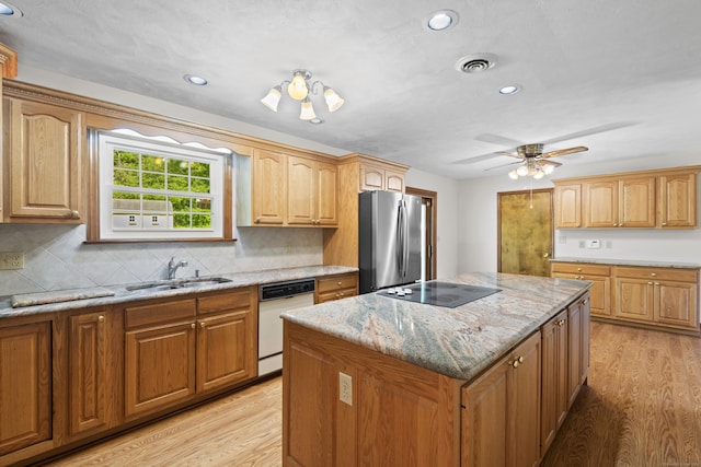 246 Sea Hill Rd, North Branford, CT 06471 - kitchen featuring dishwasher, freestanding refrigerator, a sink, black electric stovetop, and a kitchen island