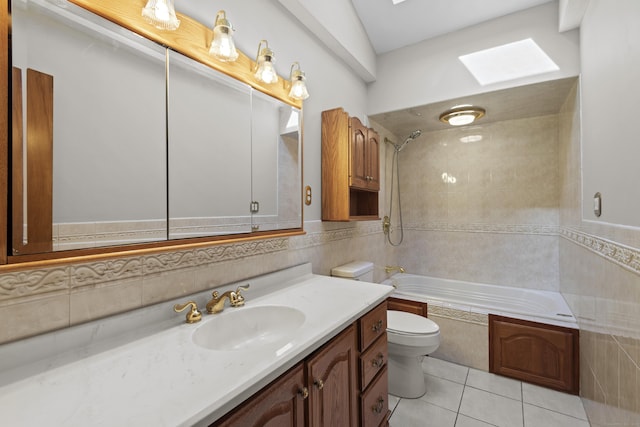 246 Sea Hill Rd, North Branford, CT 06471 - full bathroom featuring a skylight, toilet, vanity, shower / bath combination, and tile walls